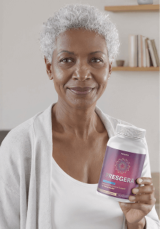 Julia holding a bottle of Alitoryn